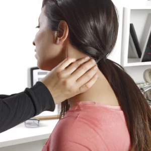 Physiotherapist relieving neck pain